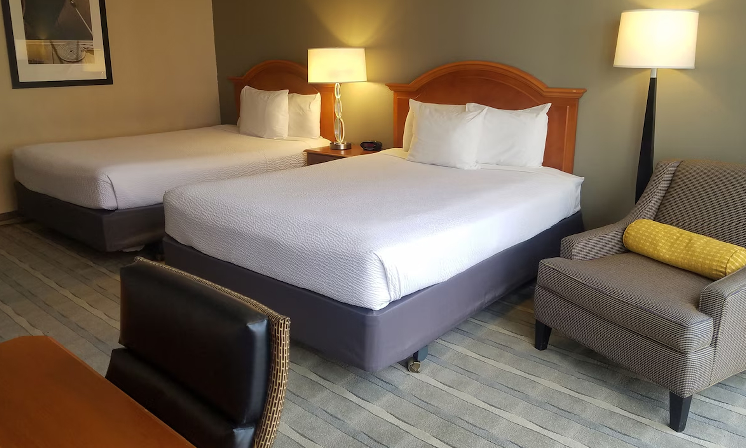 Comfortable hotel room with two queen beds